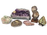 several different types of rocks and stones on a white surface