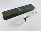 a knife that is sitting on a table next to a box