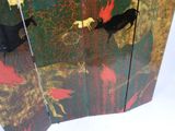 an image of a room divider with a painting on it