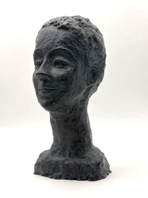 sculpture of a woman ' s head on a pedestal on a white background