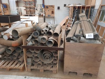 a large pile of pipes and pipes in a warehouse