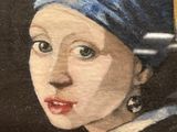 a painting of a girl with a pearl earring