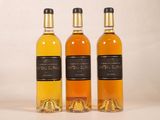 three bottles of wine sitting next to each other on a table
