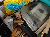 a pile of assorted items including a toaster and other household items