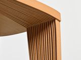 close up view of a wooden chair with a curved seat