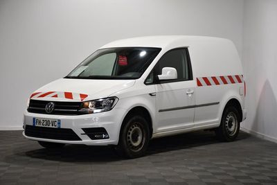 a white van parked in a room with a checkered floor