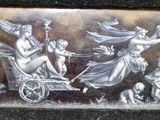 a picture of a picture of a woman being pulled by a carriage