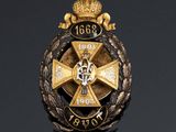 a close up of a badge on a black surface