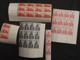 four different types of stamps on a black surface