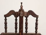 a wooden chair with a wooden back and a wooden seat