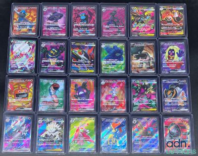 a close up of a collection of pokemon cards on a table