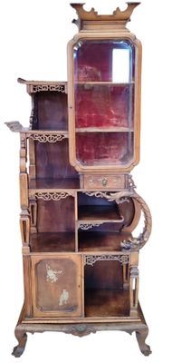 a tall wooden cabinet with a mirror on top of it