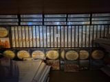a lot of dvds on the shelves in the store