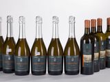 six bottles of wine are lined up in a row on a table