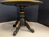 an image of a black and gold table in a corner of a room