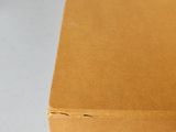 a close up of a brown box with a logo on it