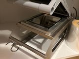 a toaster that is sitting on a shelf in a kitchen