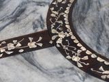 a close up of a decorative object on a marble table