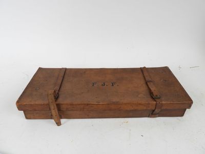 an old wooden box sitting on top of a white table