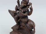 a bronze statue of a man riding on a horse