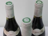 two bottles of wine that are sitting on a table