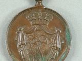 an image of a medal with a ribbon around it on a table