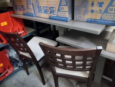 two chairs sitting next to each other in a room