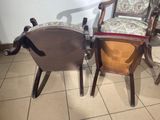 two chairs that are next to each other on a tiled floor