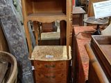 a tall wooden cabinet with a drawer on top of it