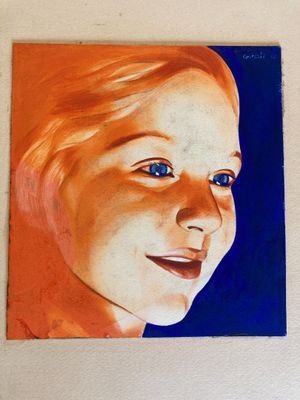 a painting of a woman with blue eyes on a wall