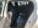 the back seat of a car with a seat belt in the back of it