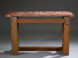 an old wooden table with a marble top on a gray background