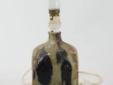 an image of a bottle with a light on top of it