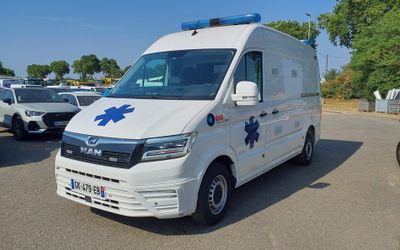 an ambulance that is parked in a parking lot