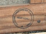 a close up of a wooden box with a stamp on it