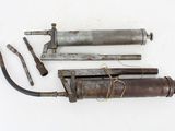 two old tools that are laying on a white surface