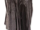 three coats hanging on a clothes rack on a white background