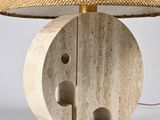 a lamp that is on a table with a lamp shade on it