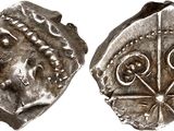 a silver coin with an image of a man and a woman on it