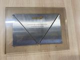a plaque on the wall of a building that has a picture of a plane on it