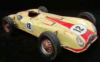 a toy car that is sitting on a black surface