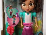 the doll is in the box with the doll in it