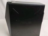 an asus desktop computer sitting on top of a white surface