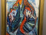 peinture sur le mur d'un musée représentant un homme dans un bateau