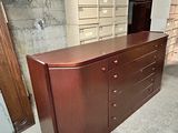 an image of a dresser in a room with a lot of drawers