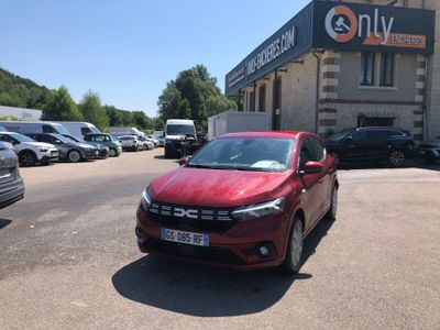 a red car that is parked in front of a building