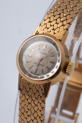 an image of a close up of a wrist watch on a table