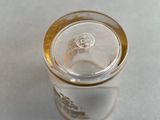 a glass with a lid sitting on a table