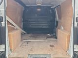 the back of a van with the door open and the back of the van with the door open