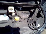 a picture of a car engine with its hood open